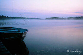 Photo of boat at sunrise