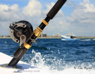 Photo of fishing boat and reel.