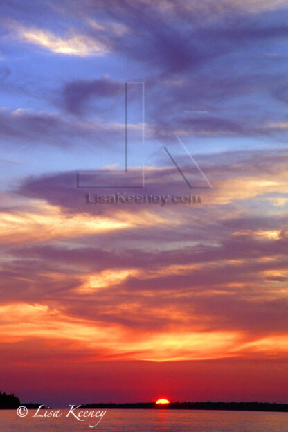 Photo of sunset on water.