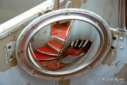 Photo of stairs in bus mirror.